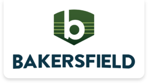 Bakersfield California Homepage2x - Alliance for Water Efficiency Bakersfield logo with a green shield and a white lowercase 'b' above the bold blue word 'BAKERSFIELD'.
