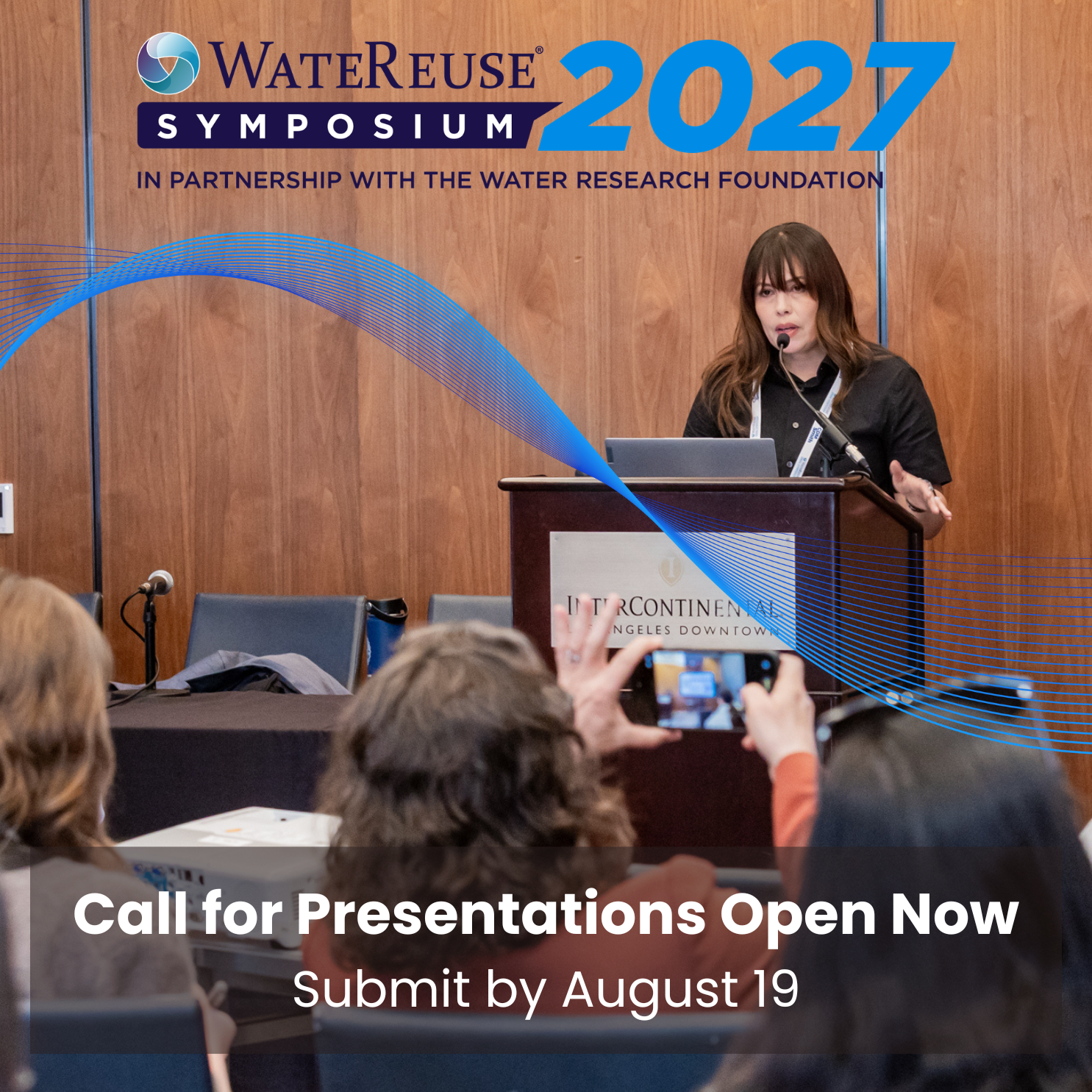 Speaker at a podium presenting at WaterReuse Symposium; audience visible, with someone taking a photo, and overlay text 'Call for Presentations Open Now'.