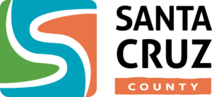 Logo with a stylized S in teal, green, and orange, next to an orange ribbon reading COUNTY.