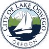 Seal of the City of Lake Oswego, Oregon, featuring a white sailboat on blue water with green trees and the city name around the edge.