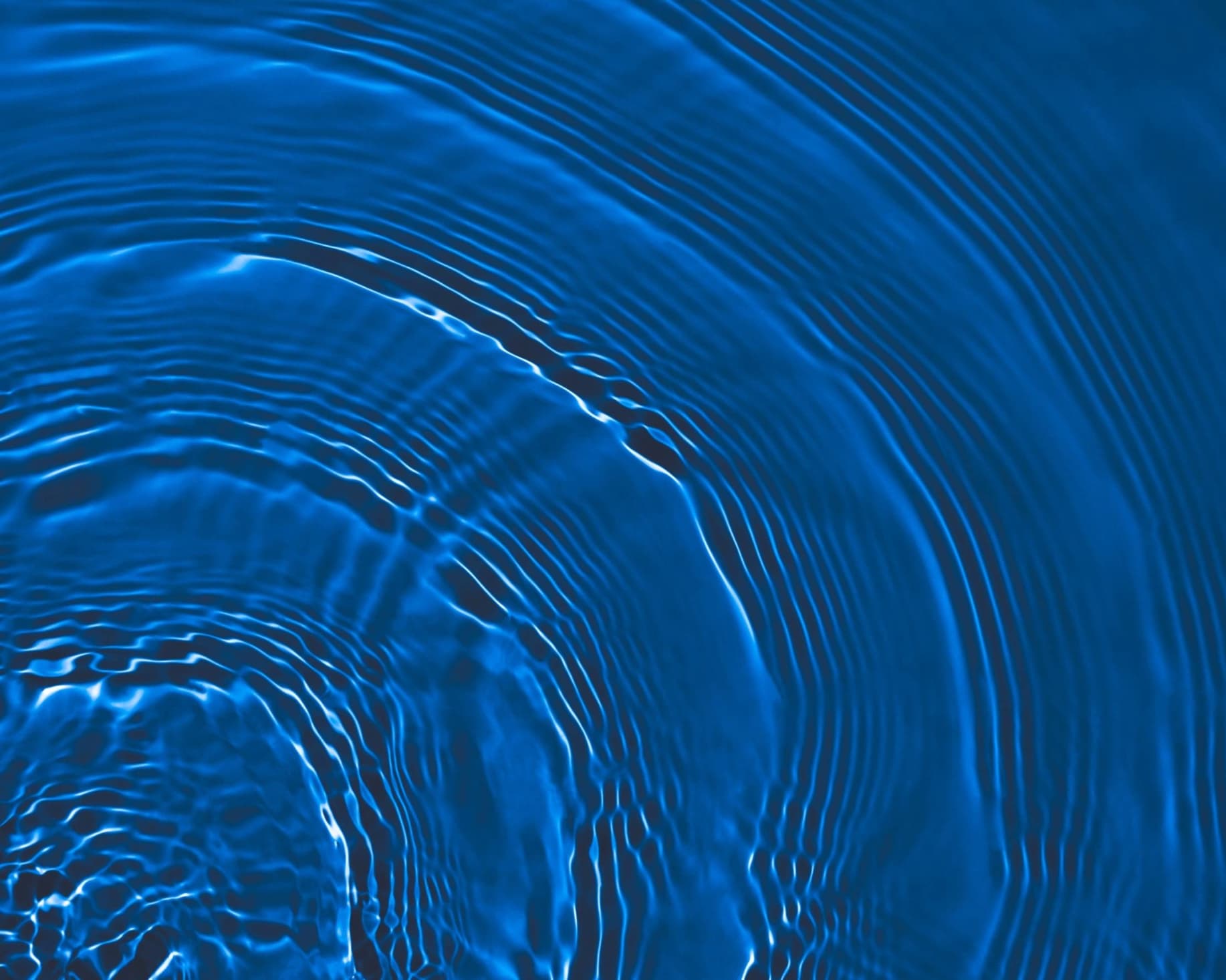 Blue abstract water ripple texture used as a decorative background.